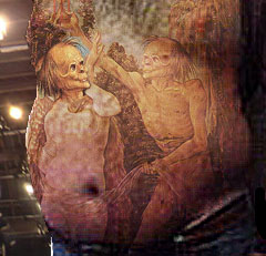 Karl Rove prison tattoos, detail (chest, belly)